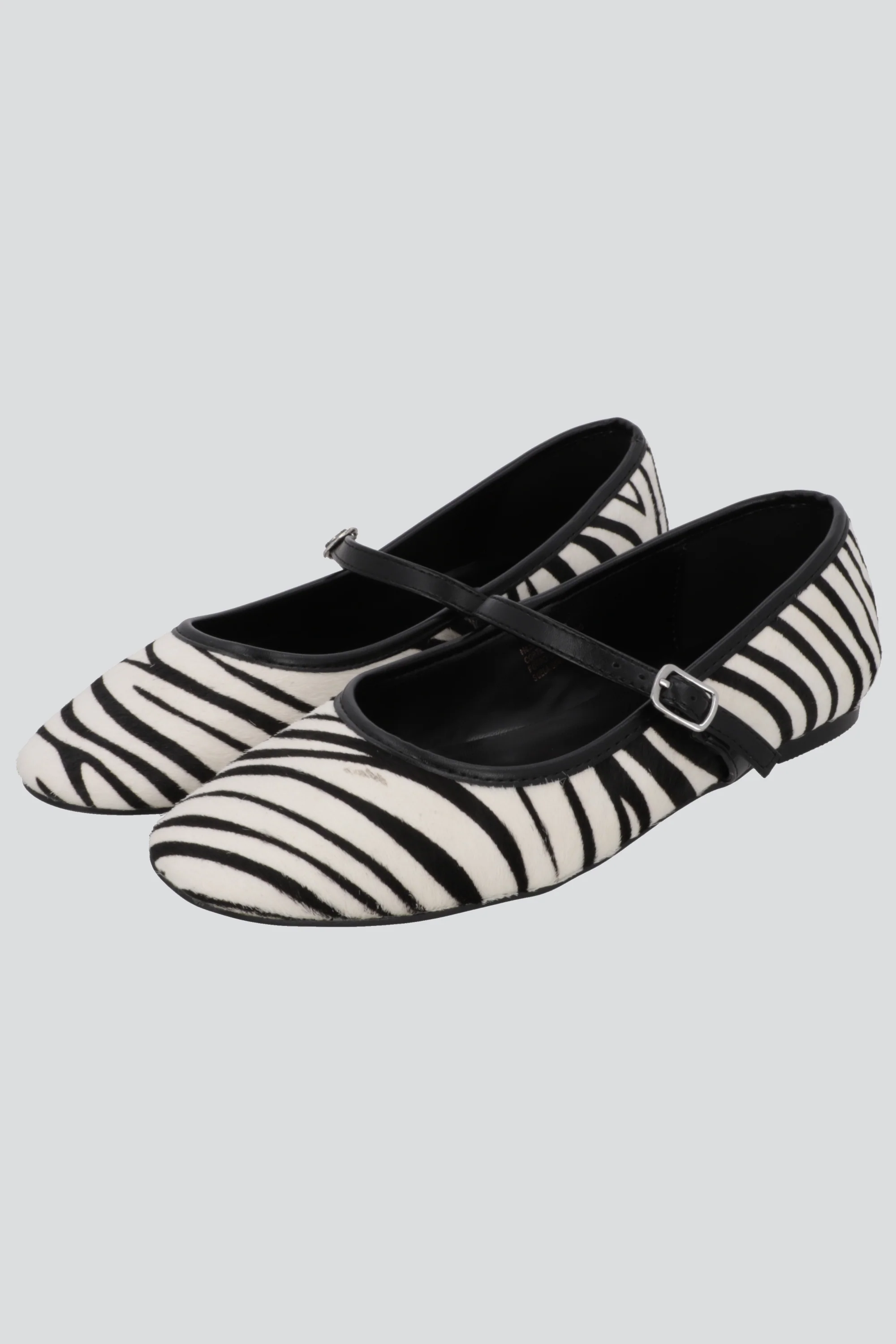 Flat animal print piel